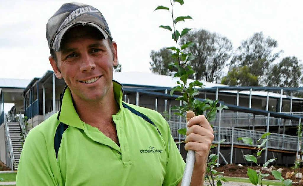 Clint Kenny finishes the gardens at Warwick East State School’s new learning resource centre, opening soon. Clint Kenny finishes the gardens at Warwick East State School’s new learning resource centre, opening soon.